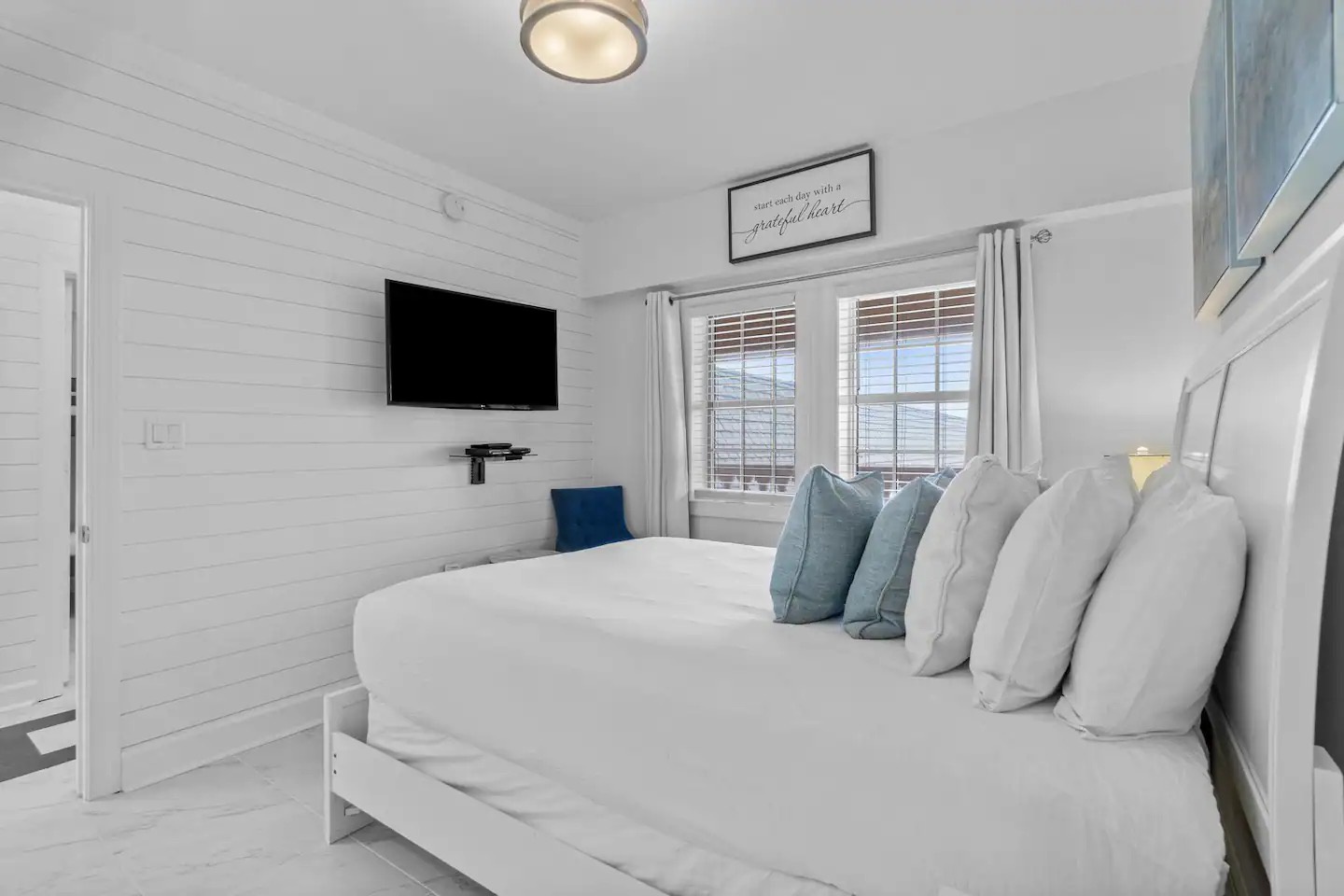 Second bedroom with queen bed TV