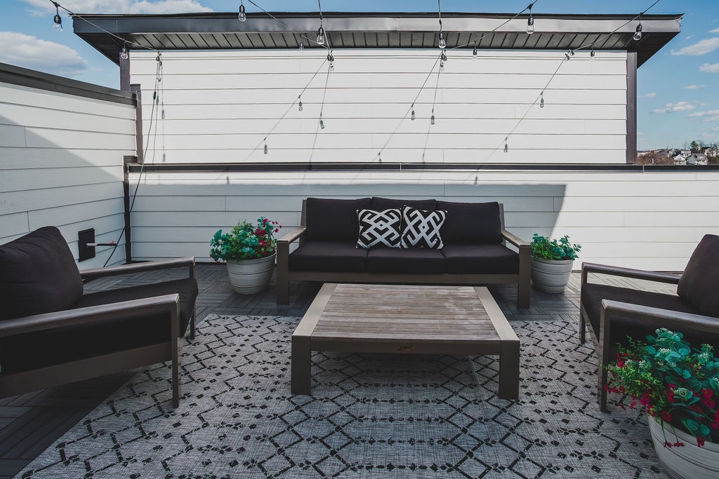 Private rooftop deck with ample seating