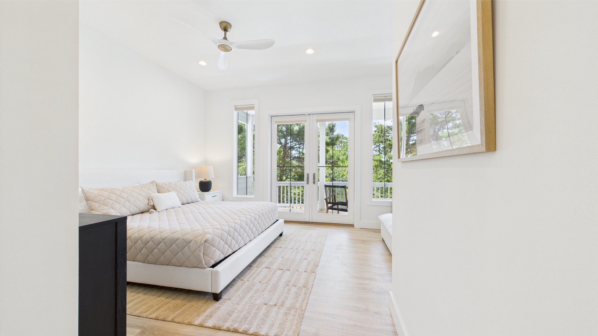 Master bedroom with king bed TV and ensuite bathroom