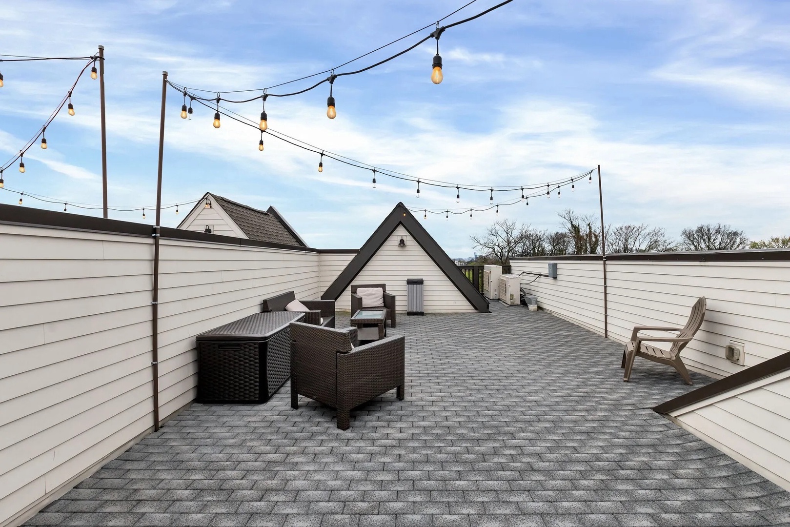 Private rooftop terrace with comfortable furnishings and scenic views