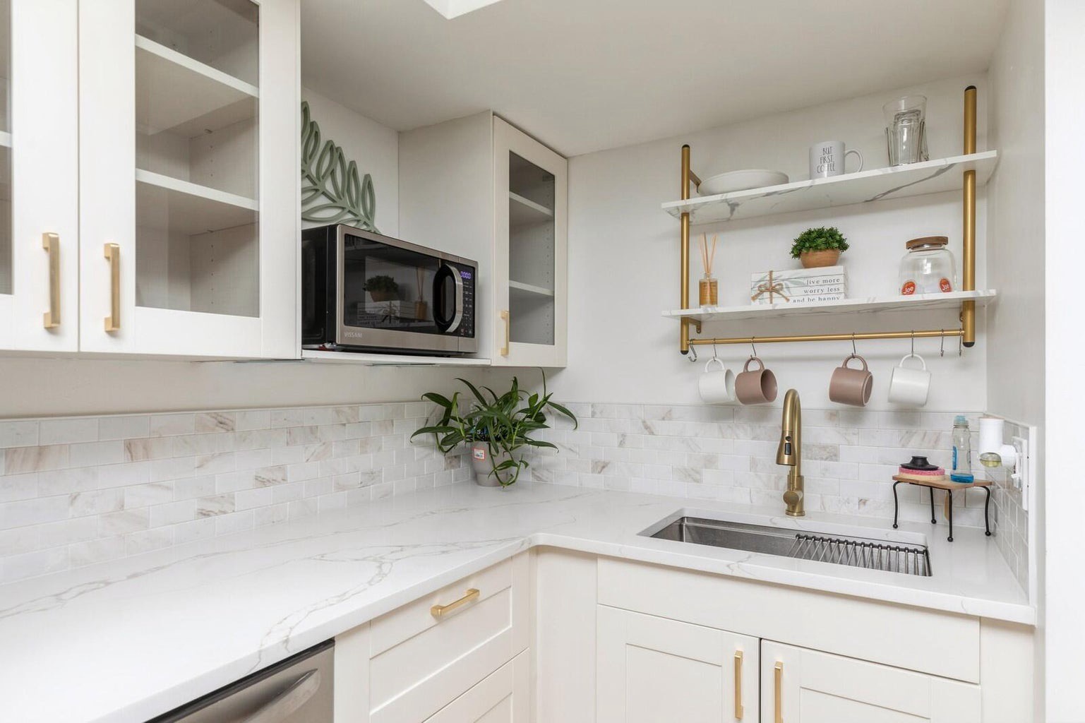 Updated stainless appliances with needed cooking supplies
