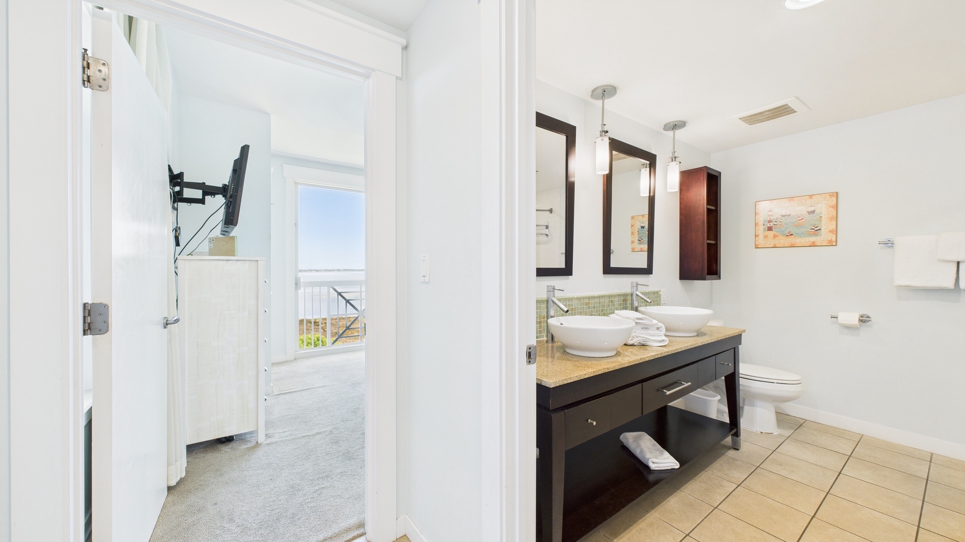 Ensuite master bathroom with dual vanity and shower/tub combo