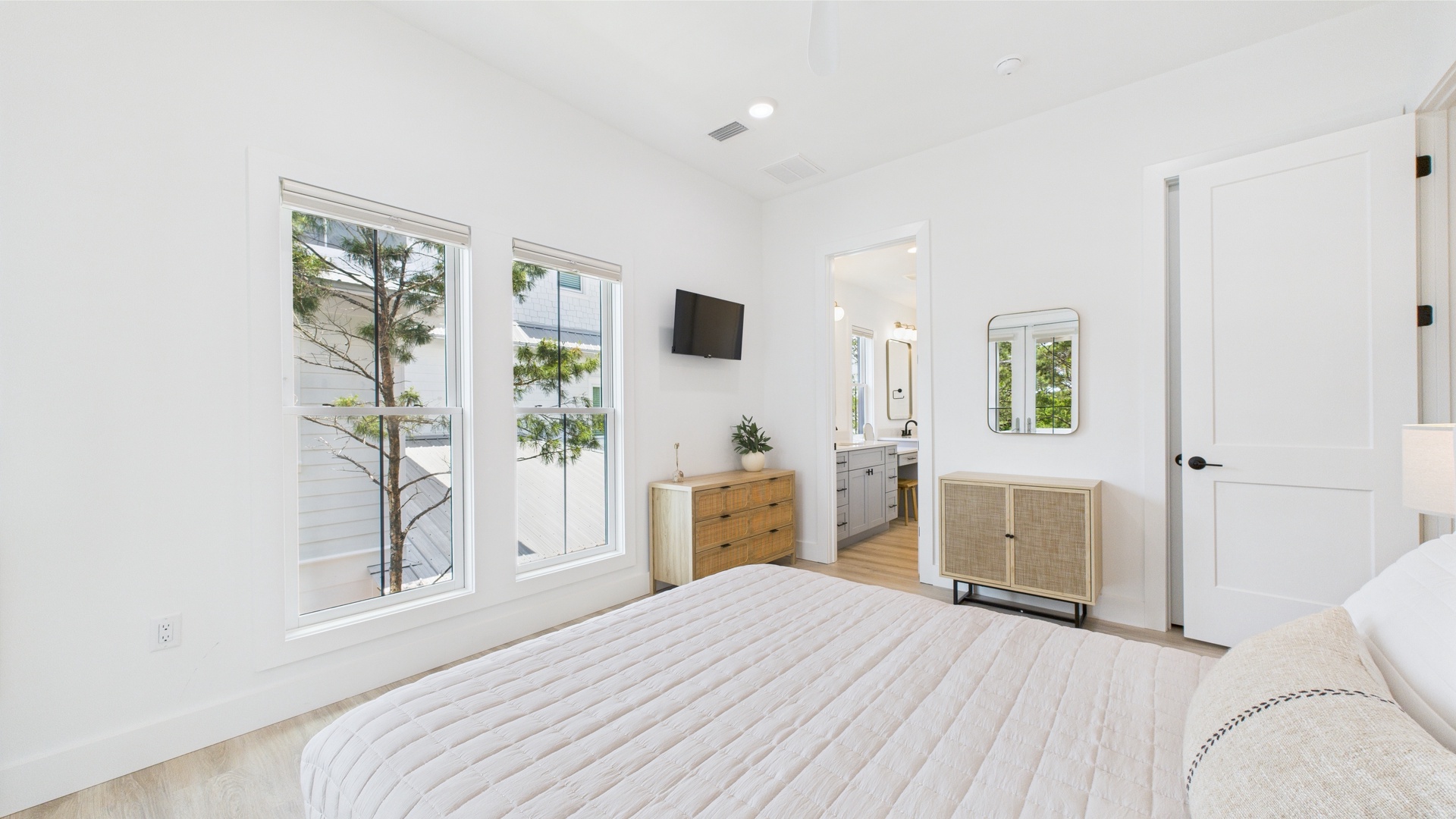 Second bedroom with queen bed TV and shared ensuite bathroom