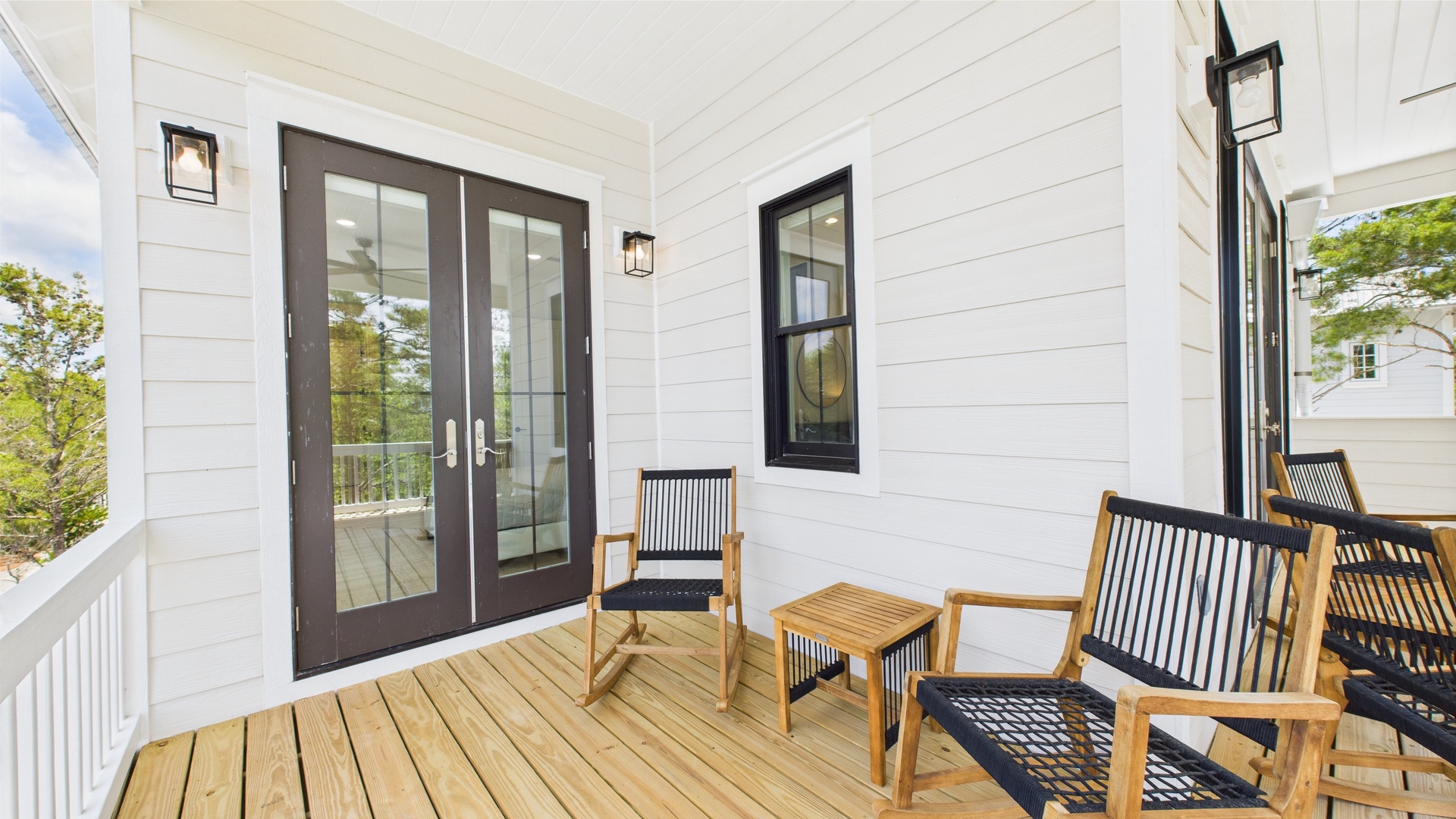 Second floor rear facing wraparound balcony with ample seating