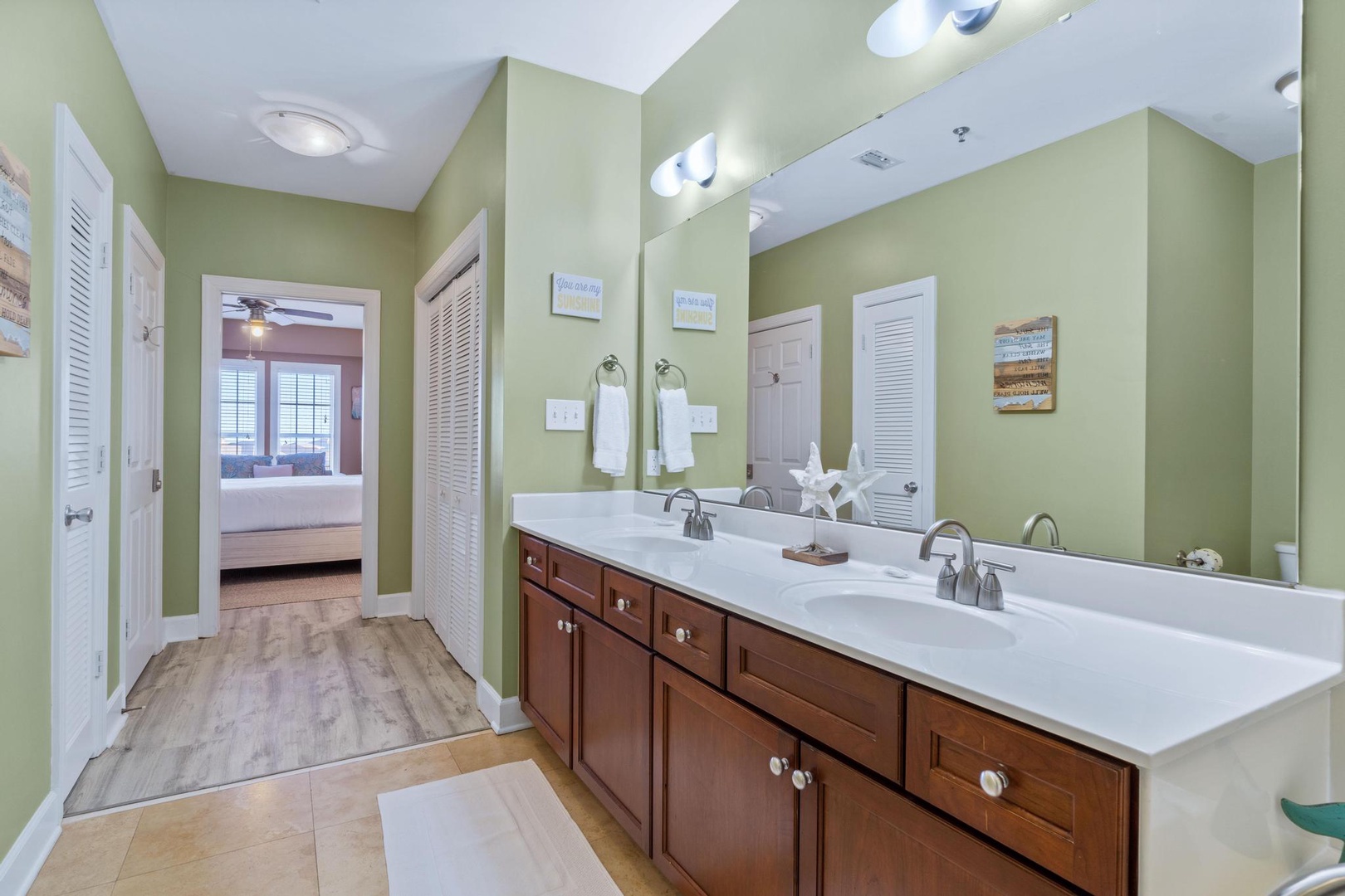 The large master bath has a double sink, over-sized shower, and a jetted jacuzzi tub