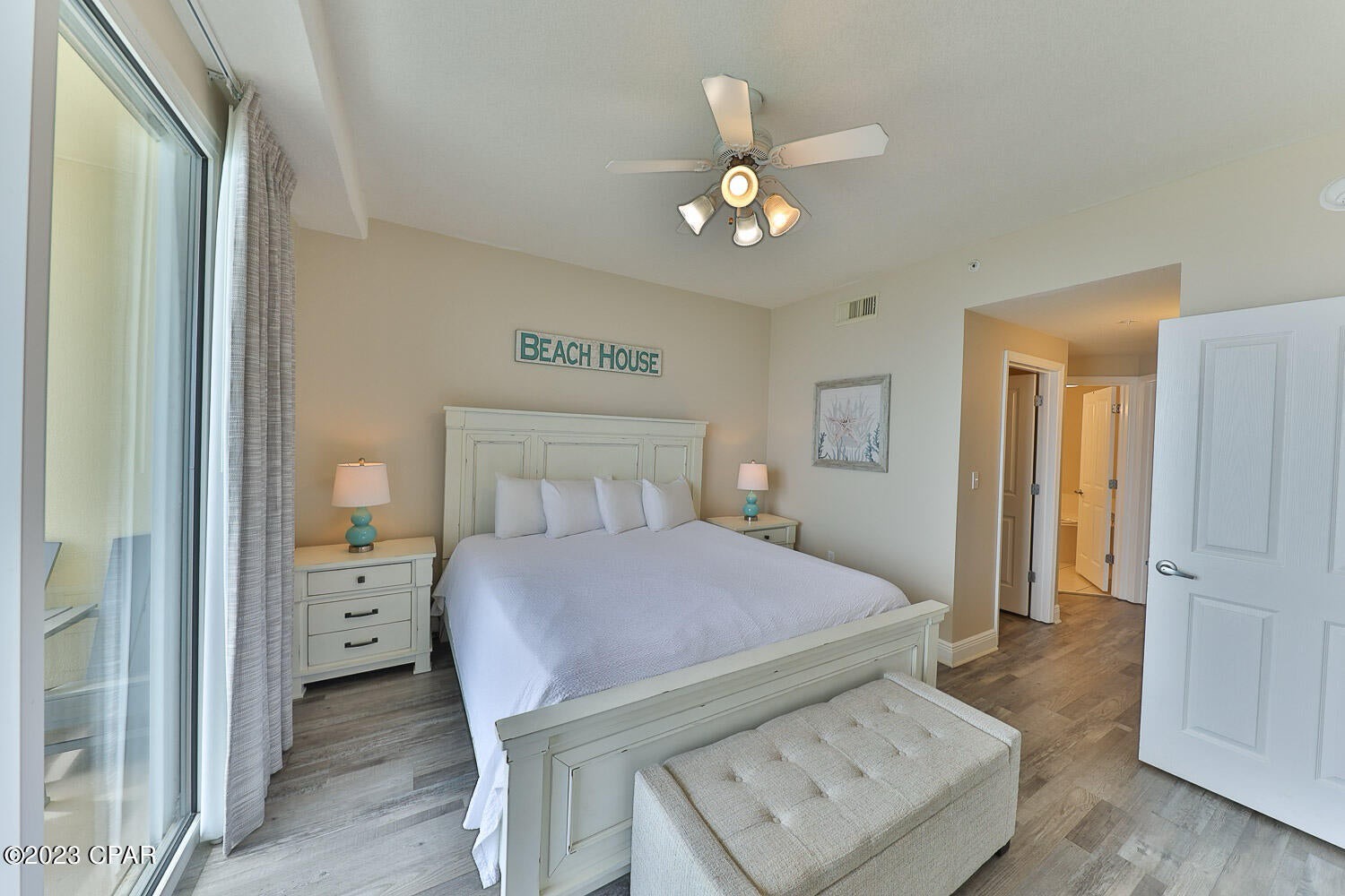 Primary bedroom with king bed and ensuite bathroom