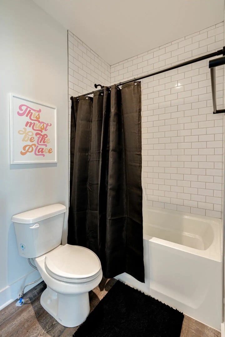 5629 - Primary bathroom with a shower and tub combo.