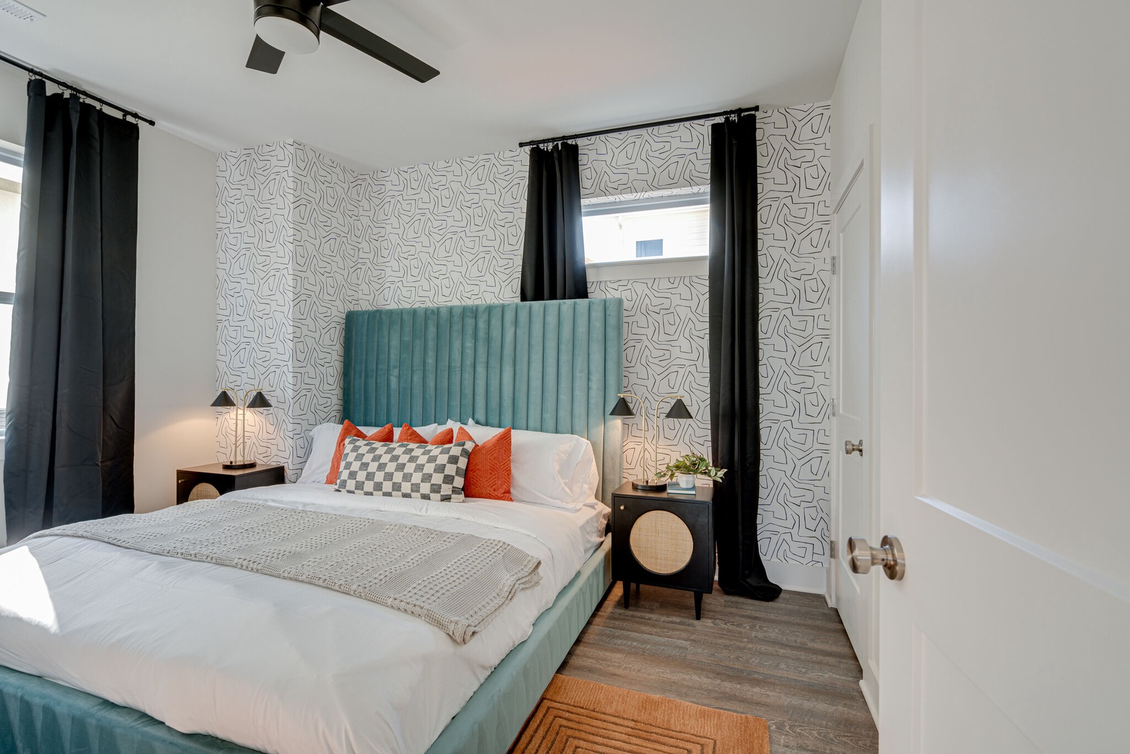 3rd bedroom with King bed, designer furnishings, and closet. Bathroom is adjacent to this room.