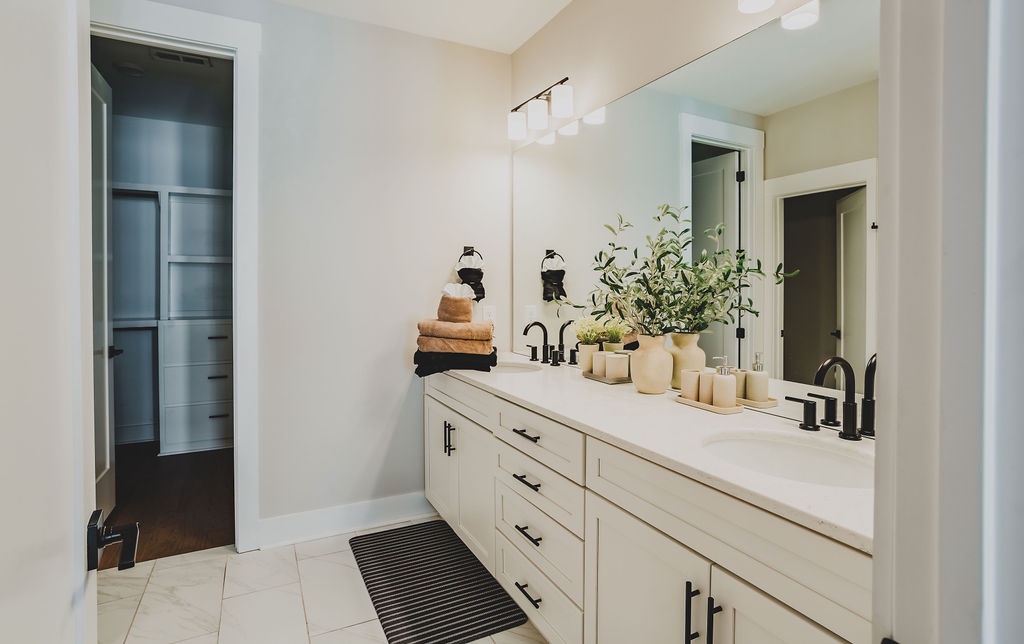 Primary bathroom with dual vanity and walk in shower