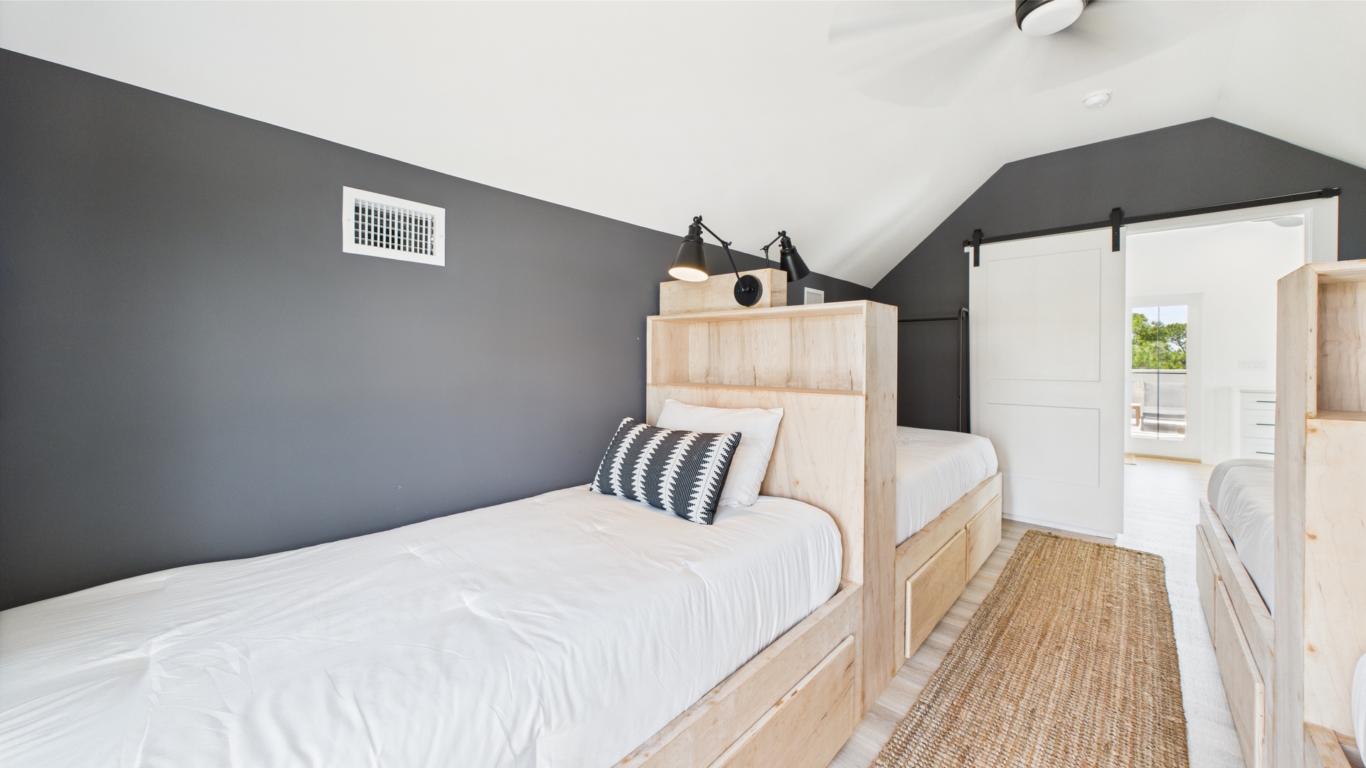 Fourth bedroom with four twin beds and balcony access