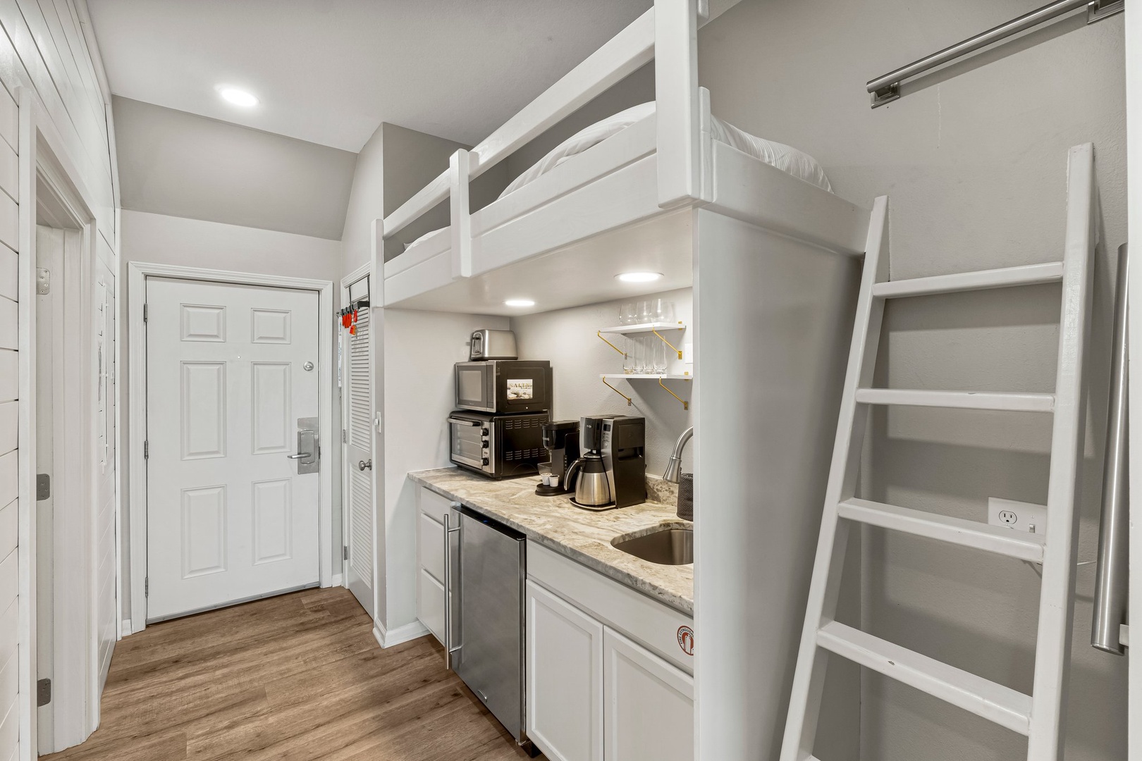 Bed above kitchen