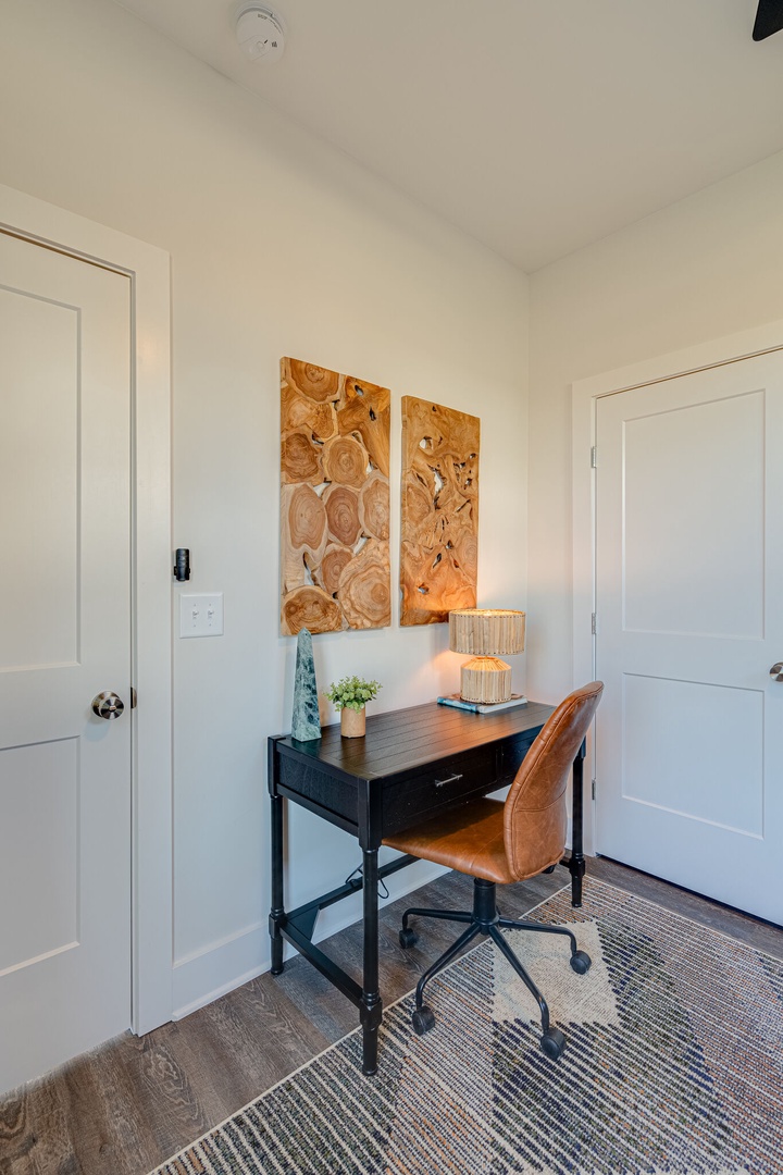3rd Bedroom / Office featuring a pull-out couch and workstation.
