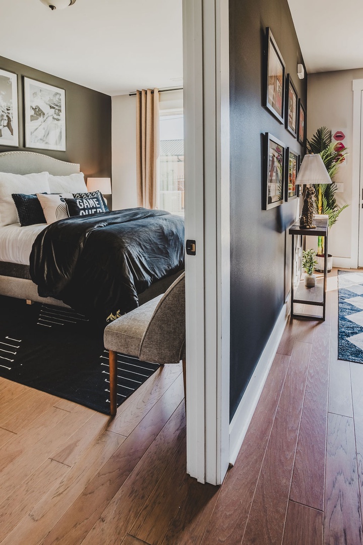 First bedroom with queen bed TV and ensuite bathroom