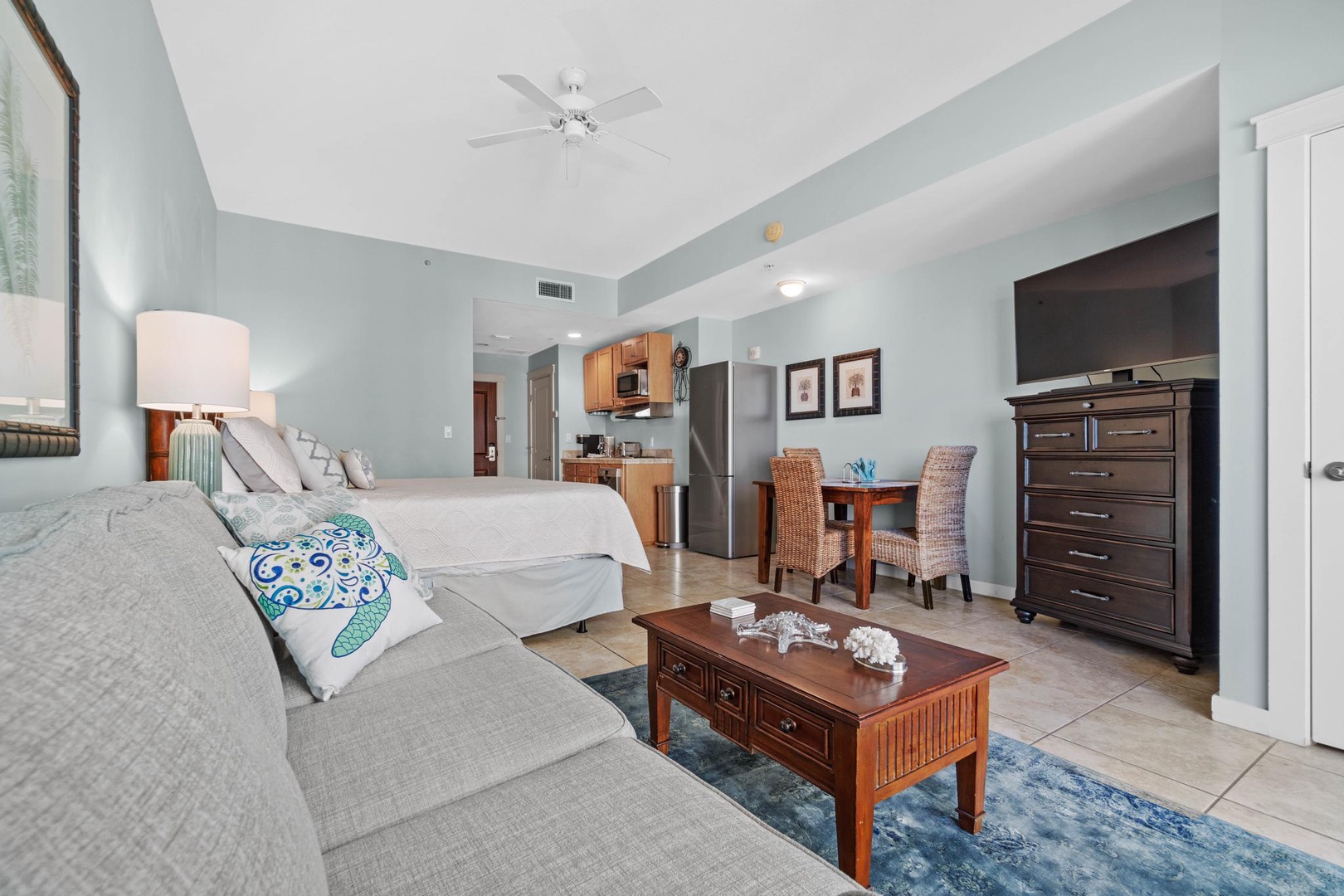 Living area with sleeper sofa and king bed