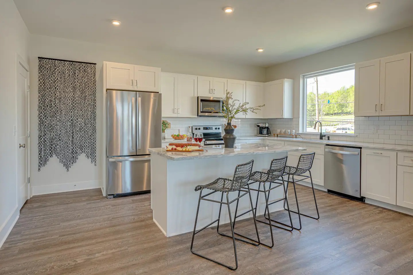 5631 - Fully equipped kitchen stocked with basic cooking essentials and stainless steel appliances.