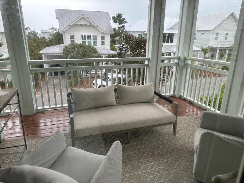 Upper level covered patio with seating. Access through guest bedroom 1 and 2