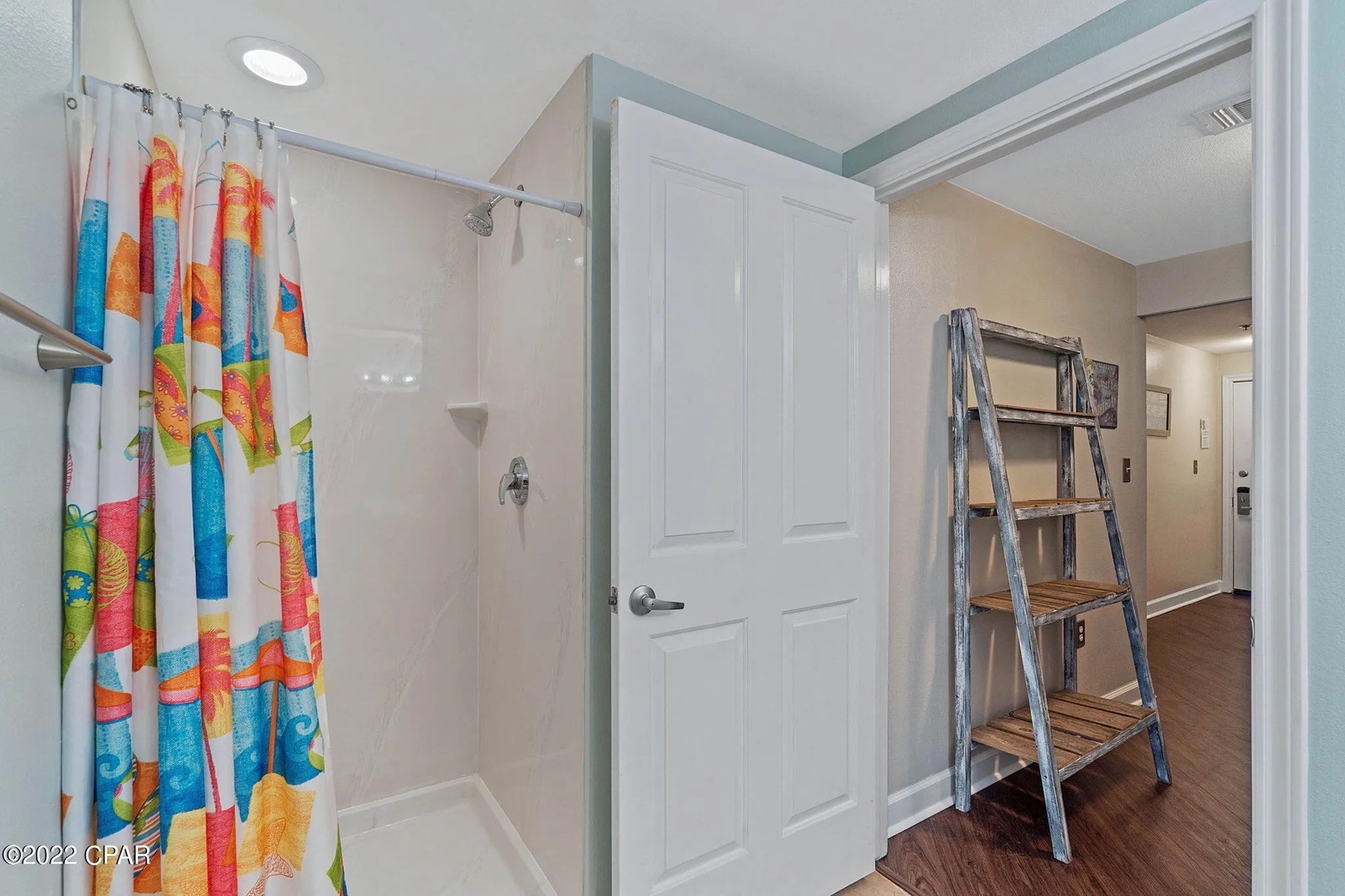 Third bathroom with shower and tub combo.