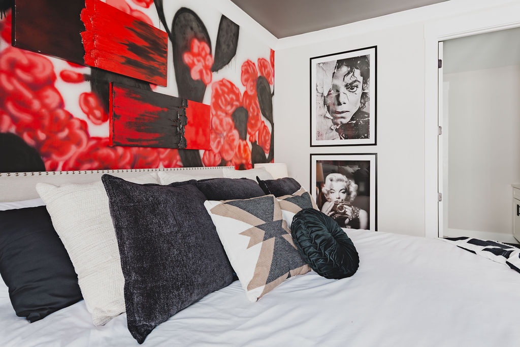 Primary bedroom with king bed TV and ensuite bathroom