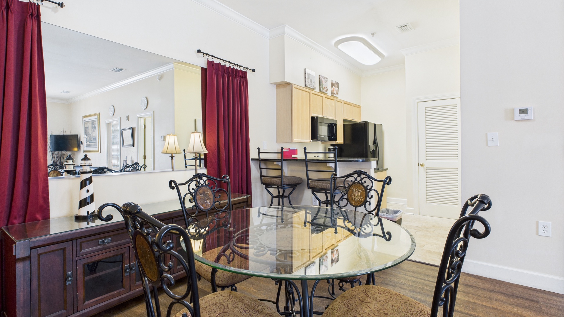 Dining table in main living area that seats 4