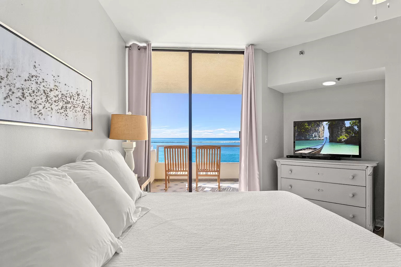 Master bedroom with king bed and access to balcony (sleeps 2)