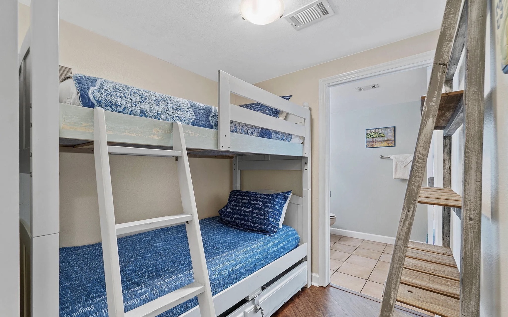 Bunk space with two twin beds and attached bathroom.