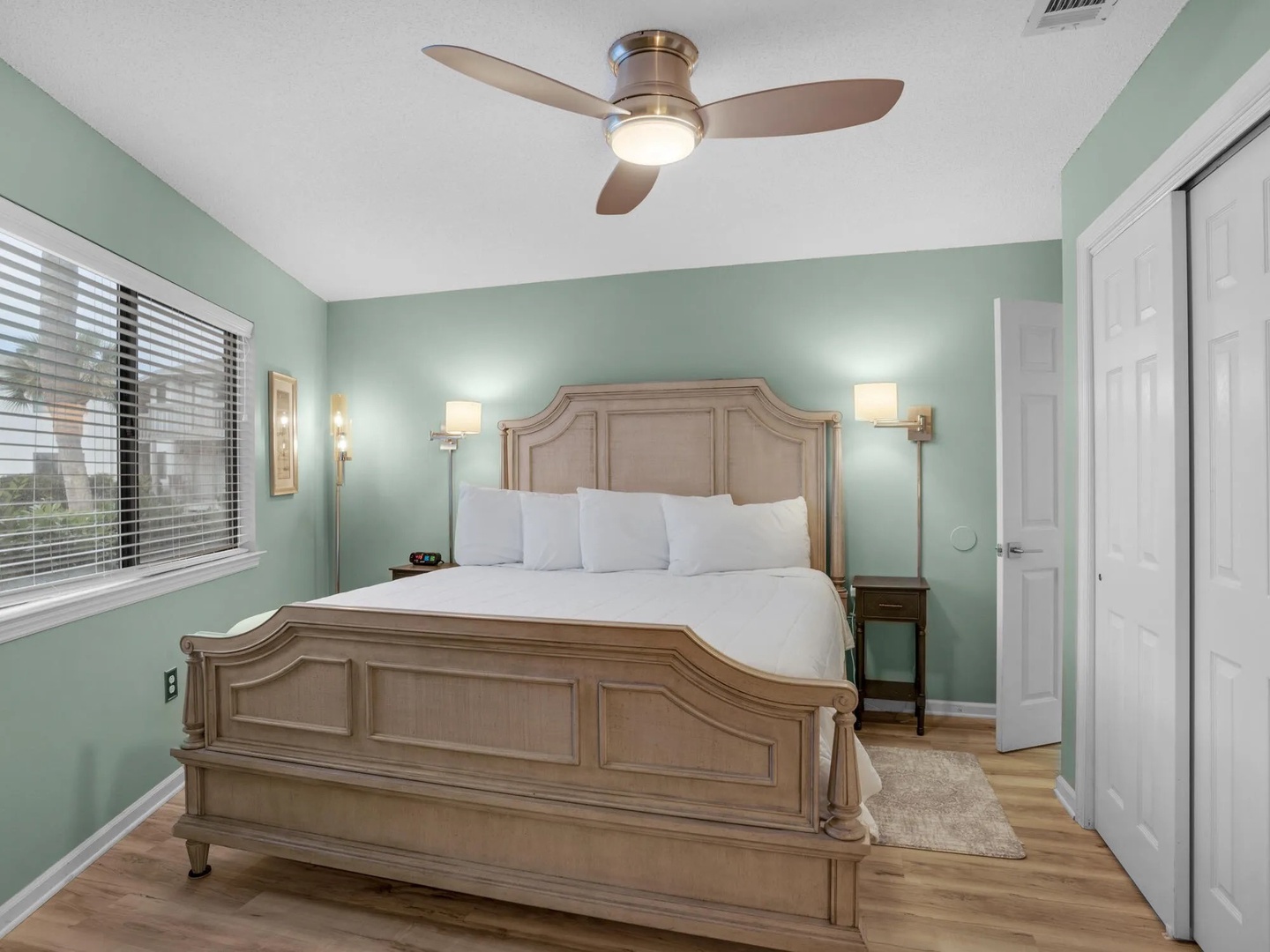 Primary bedroom with king bed, TV, and ensuite bathroom.