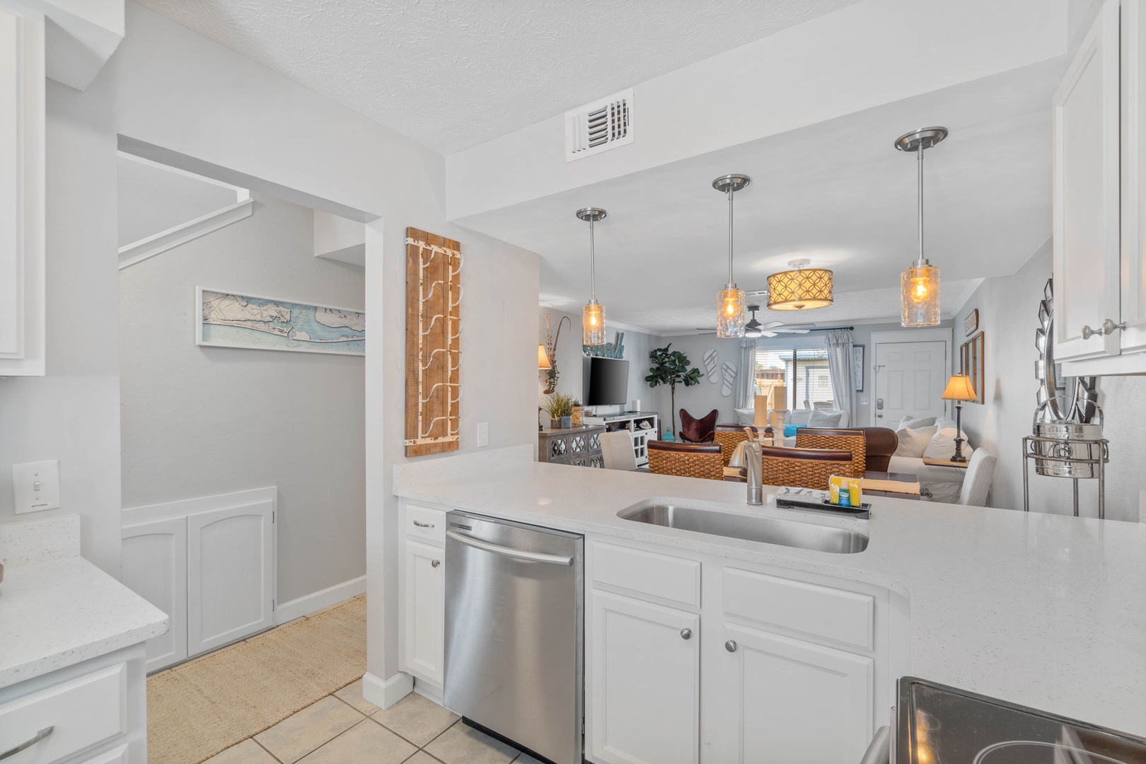 Kitchen with full amenities over looking the living room