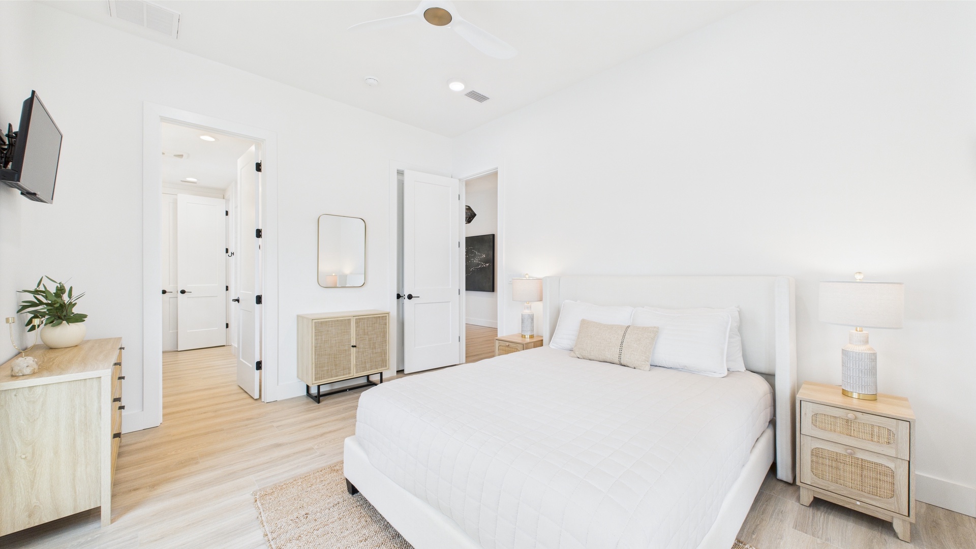 Second bedroom with queen bed TV and shared ensuite bathroom