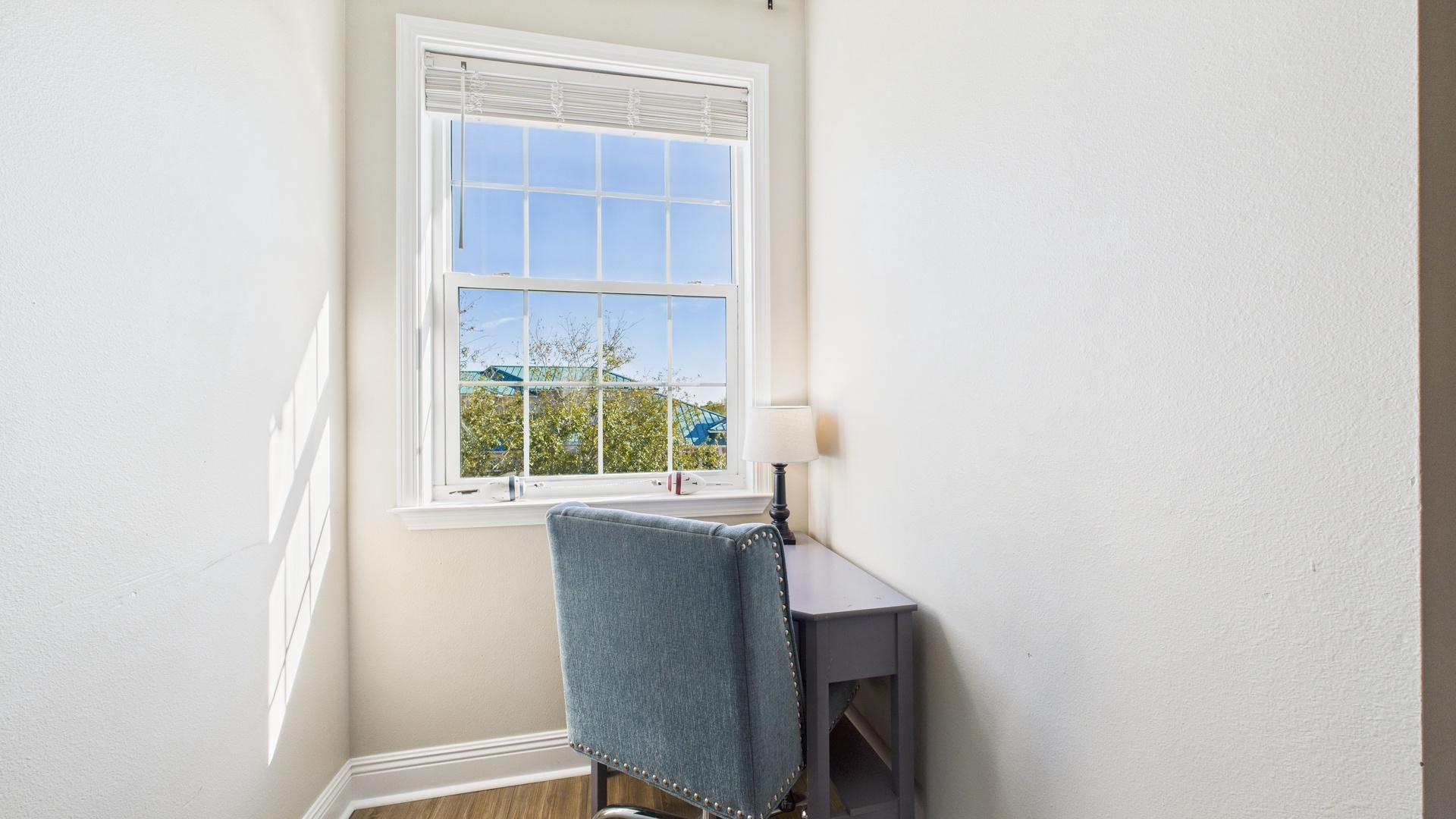 Guest bedroom with two twin beds and desk