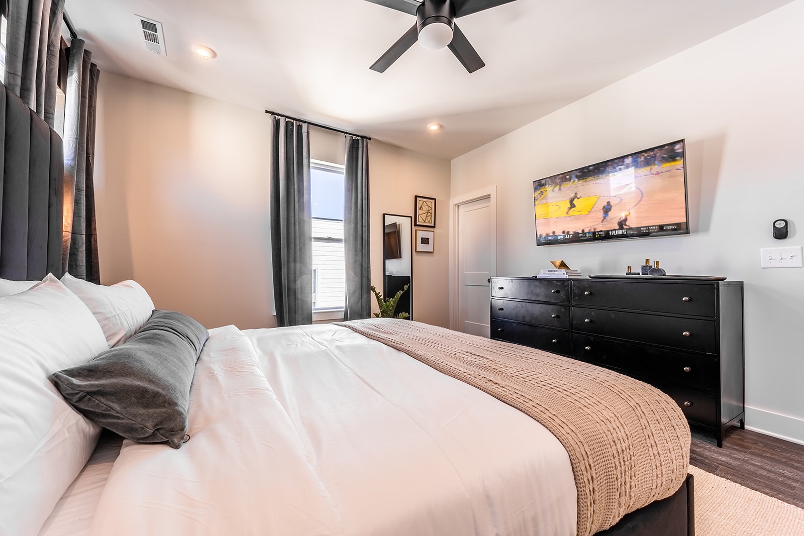Master bedroom with king bed and TV