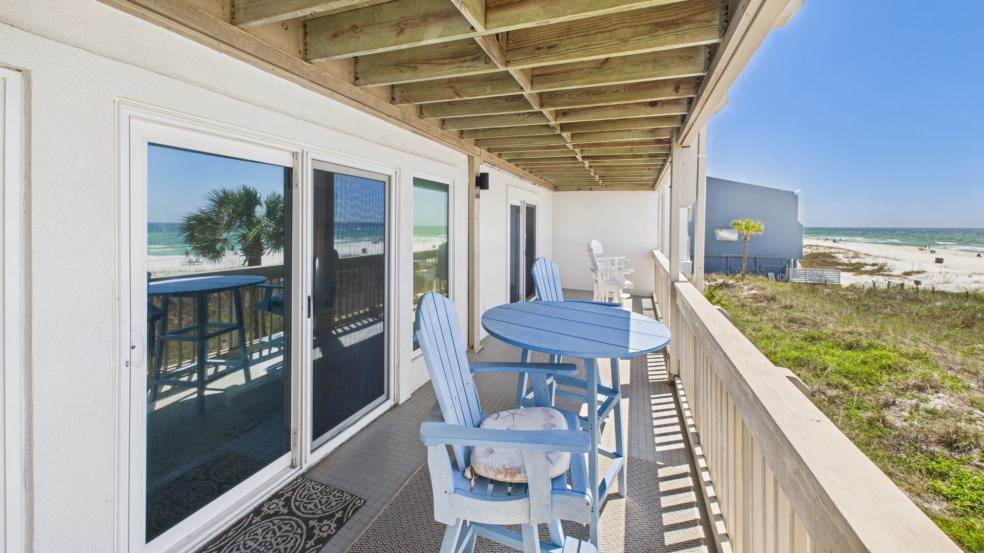 Master bedroom side of balcony with seating and table