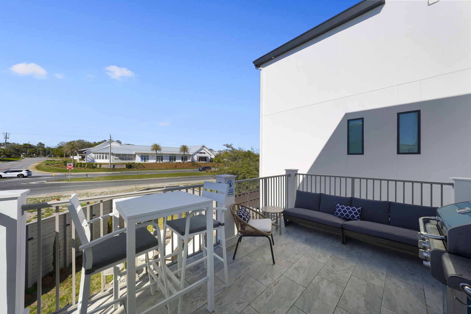 Balcony overlooking the pool area with Grill