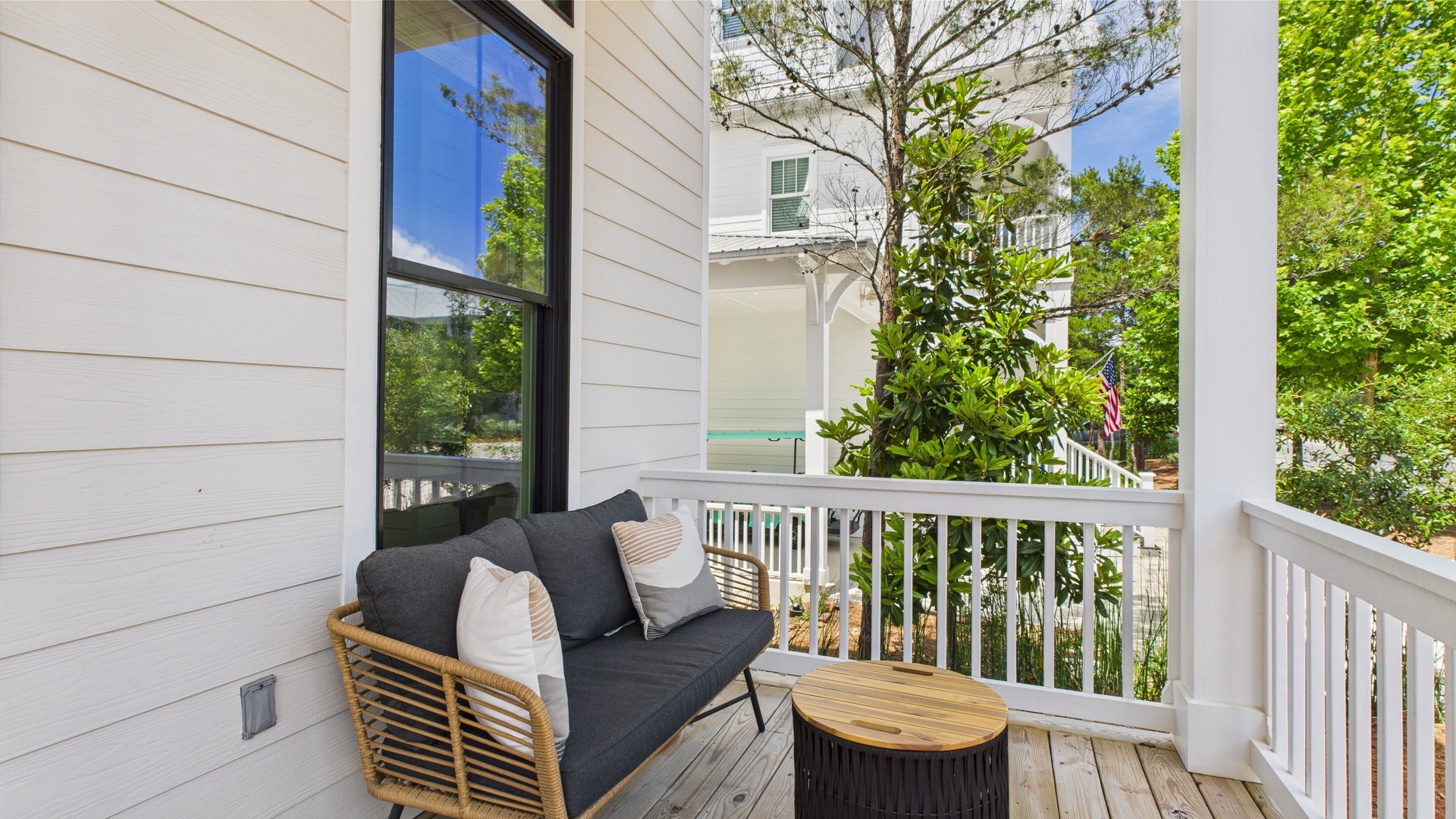Front porch with comfortable seating and entrance into home