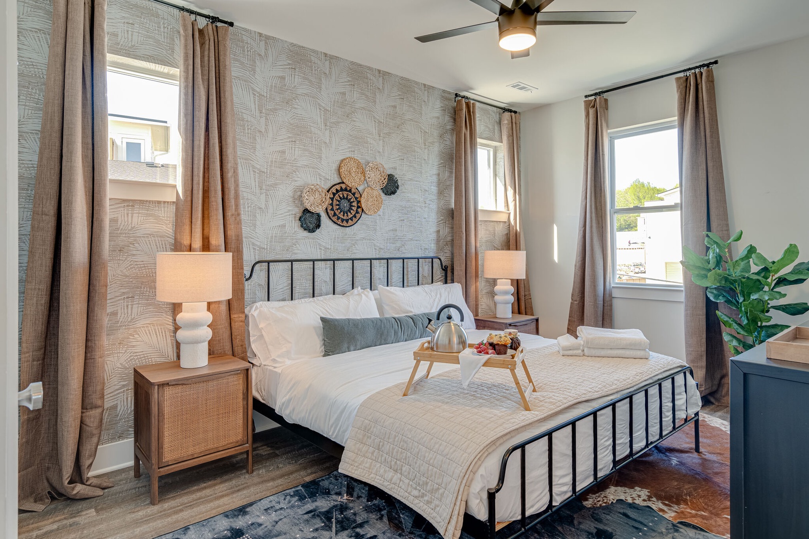 Primary Bedroom featuring a King bed, flat-screen SMART TV and designer furnishings with ensuite primary bathroom.