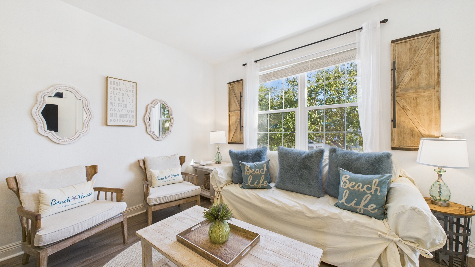 Open concept living area with TV and balcony access