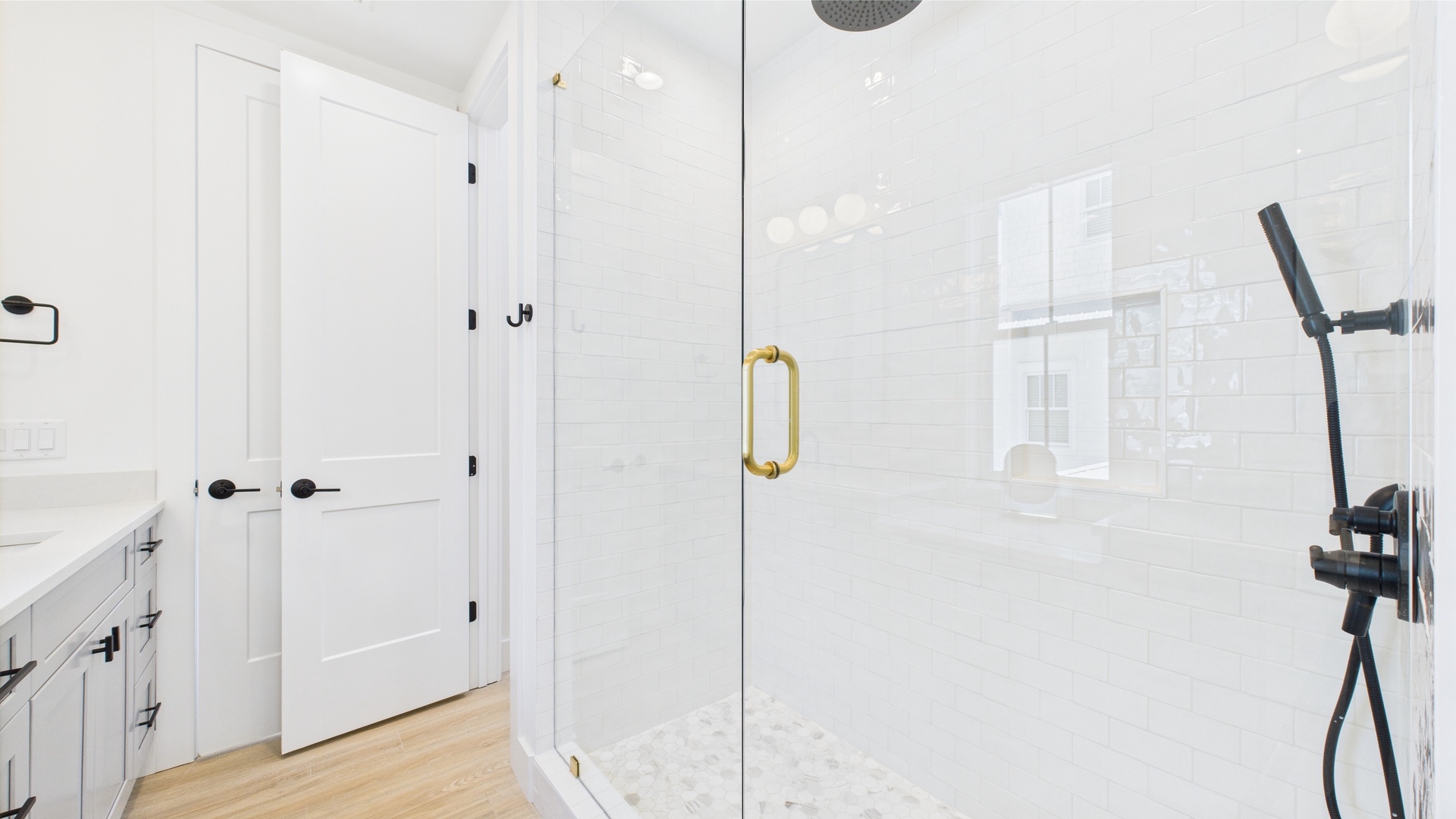 Shared ensuite bathroom with dual vanity and walk in shower