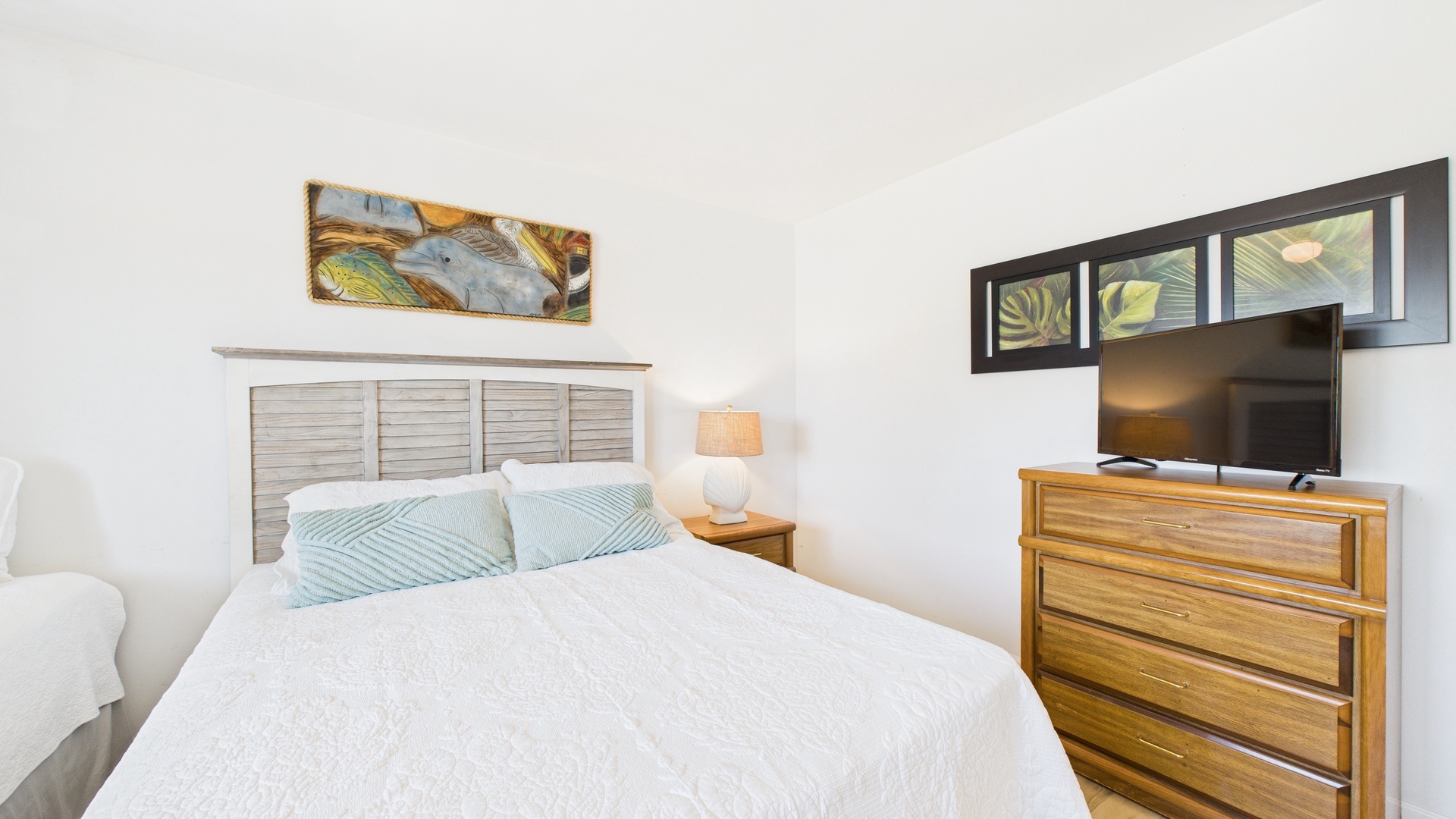 Guest bedroom with twin and queen beds TV and desk