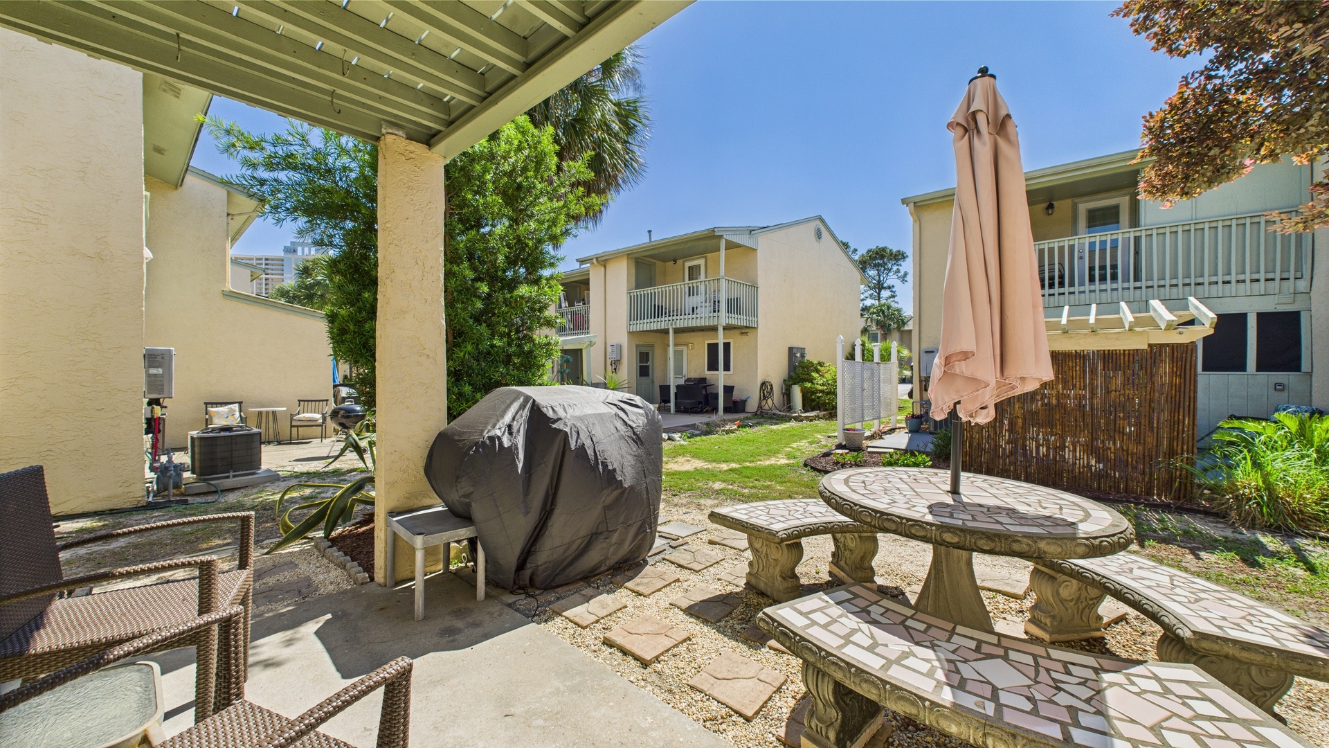 Grill and dining area in backyard