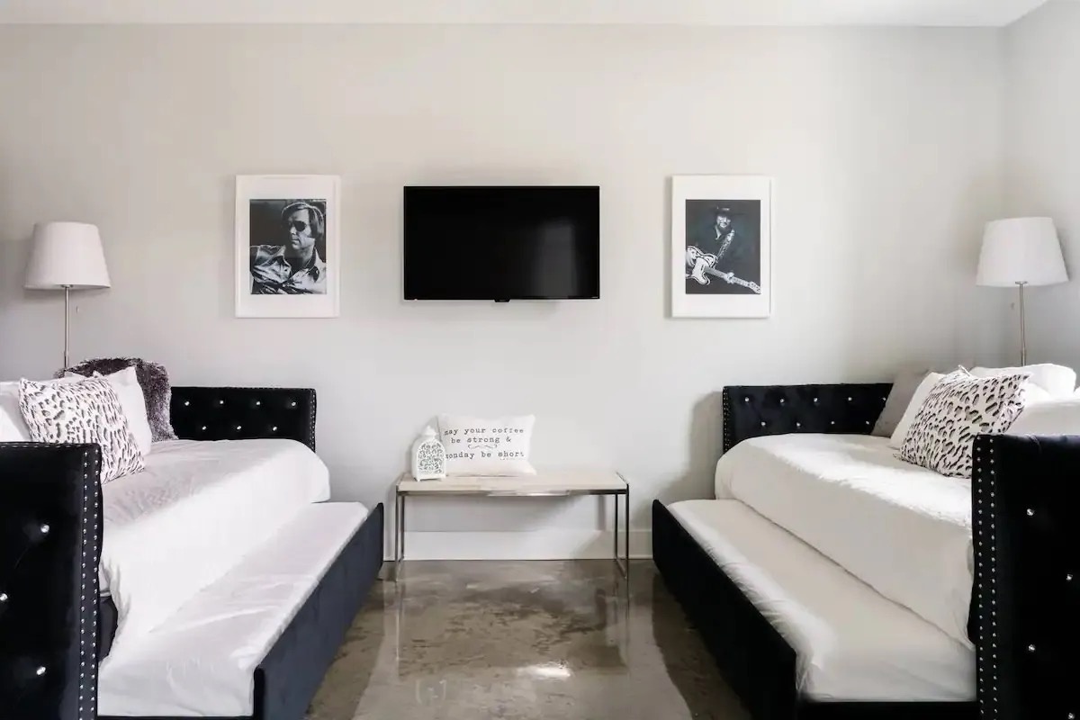 Bunk area with two trundle twin over twin beds TV