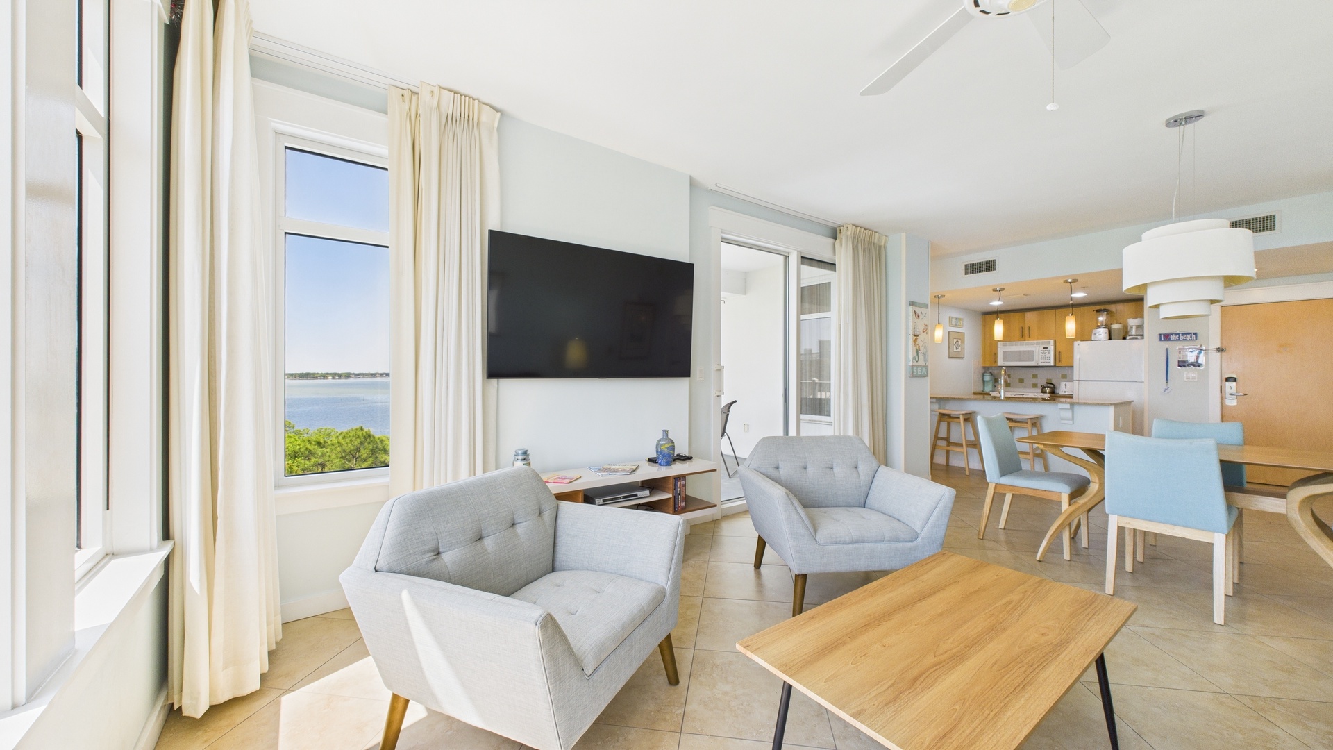 Open concept living area with stylish furnishings TV and sofa bed