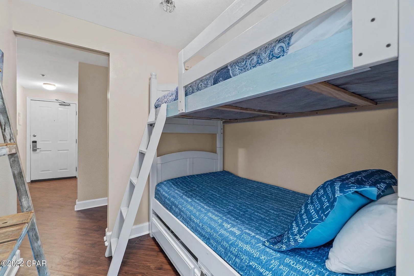 Bunk space with two twin beds and attached bathroom.