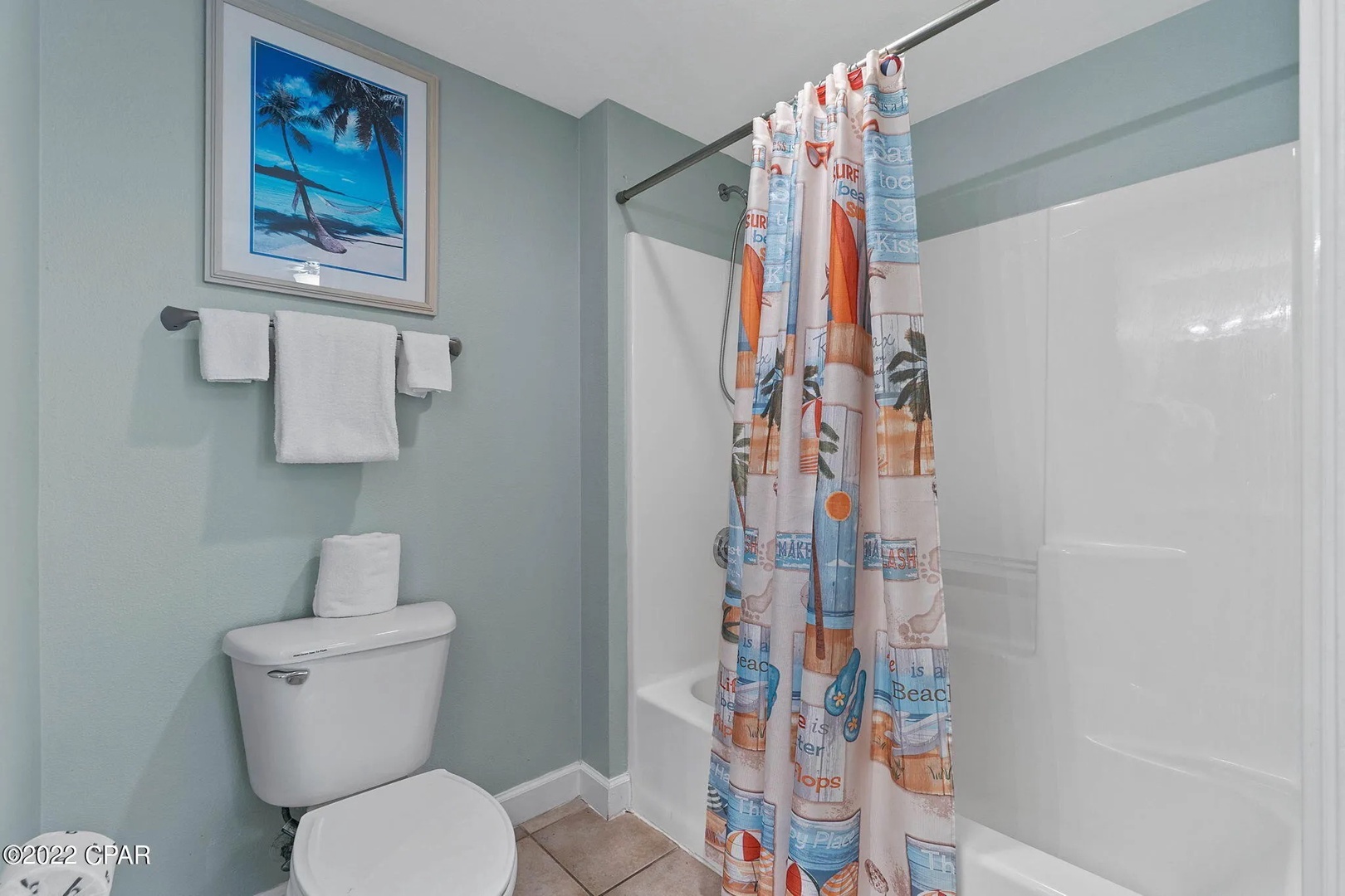 Primary bathroom with shower and tub combo.