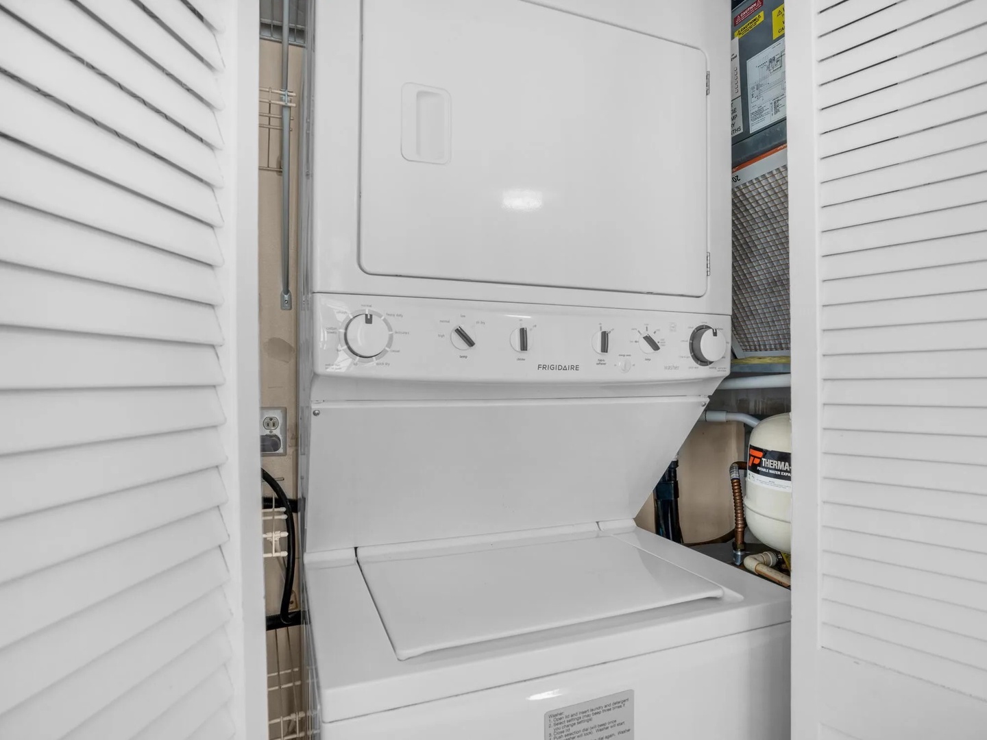 In house washer and dryer unit in closet.