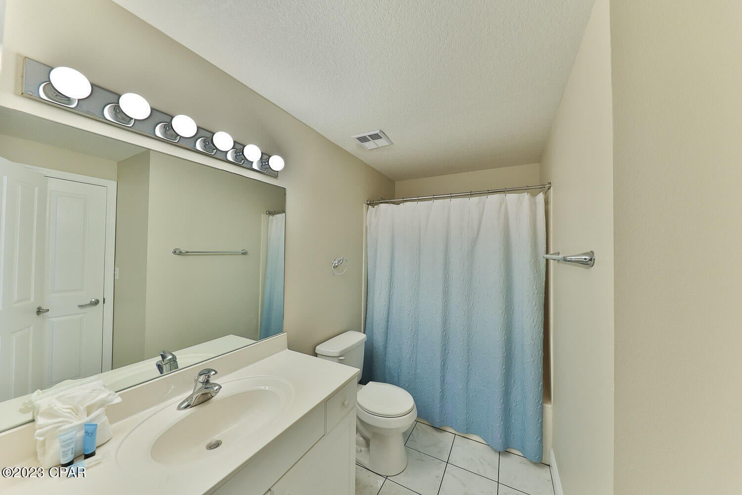 Primary guest bathroom with shower and tub combo