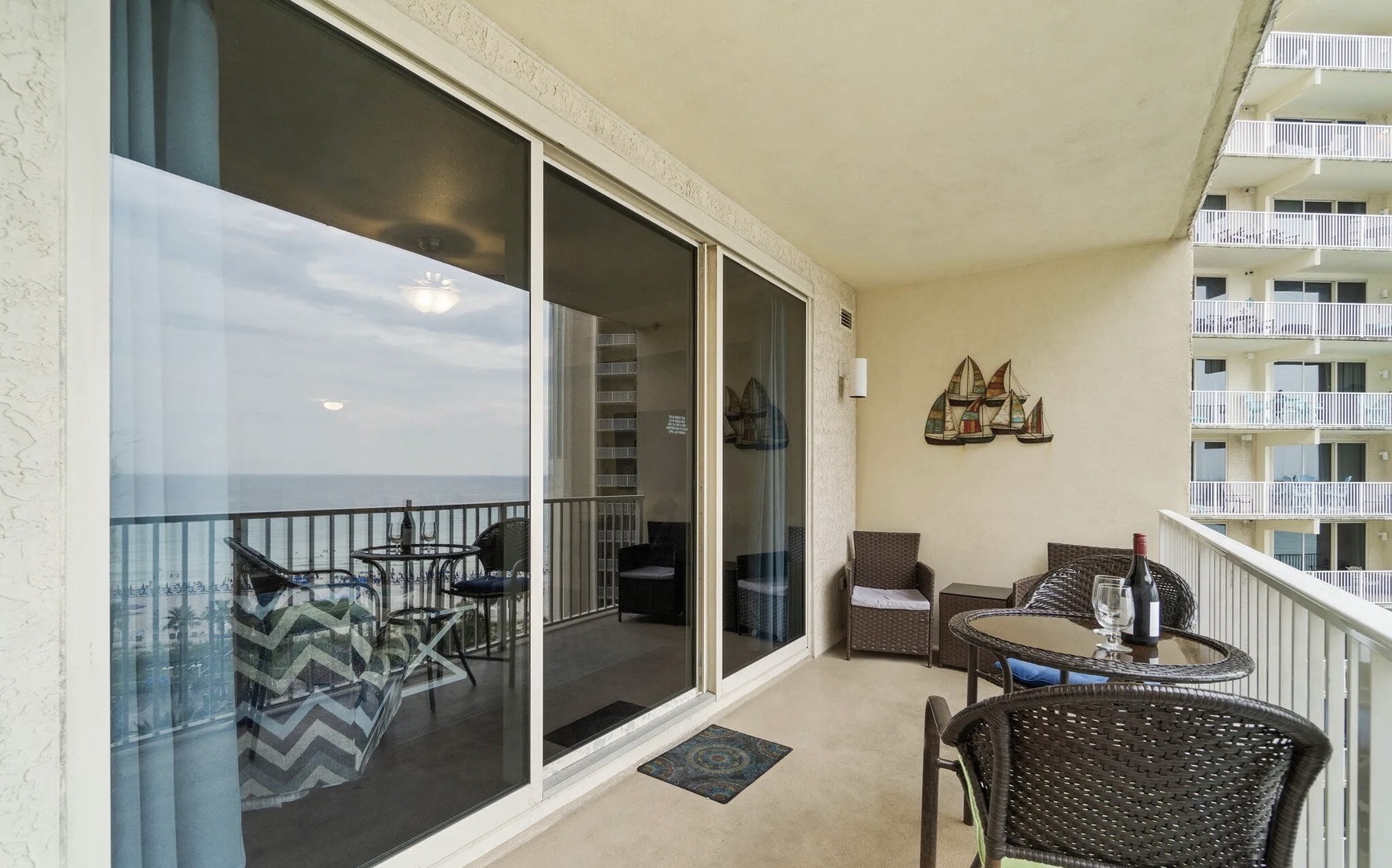 Balcony with comfortable living and dining seating.