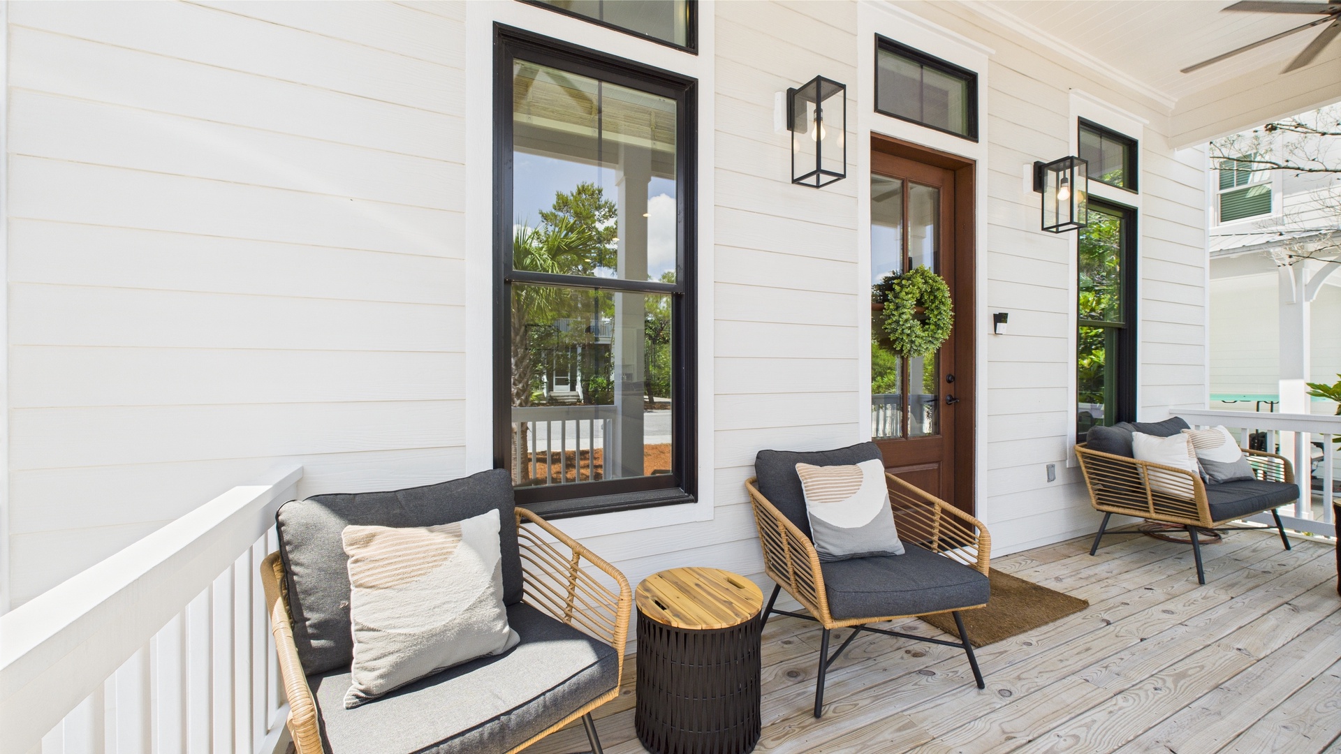 Front porch with comfortable seating and entrance into home
