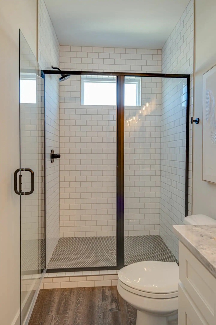 5631 - Primary Bathroom featuring a dual vanity and stand-in shower.