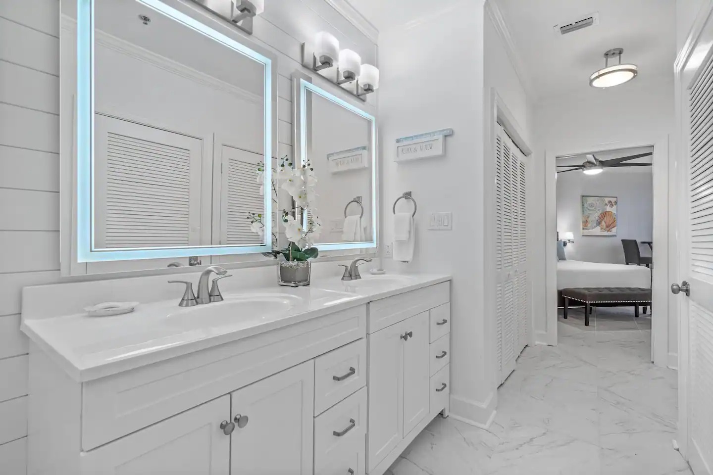 Primary bathroom with dual vanity bathtub and walk in shower