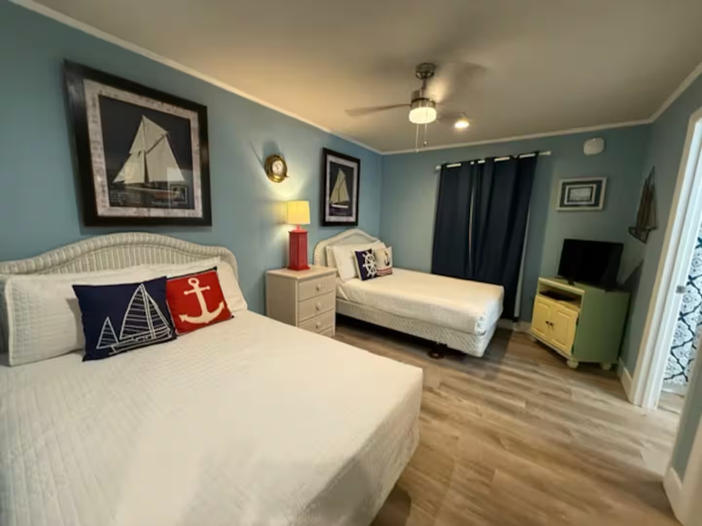 Guest bedroom with two full beds TV and ensuite bathroom