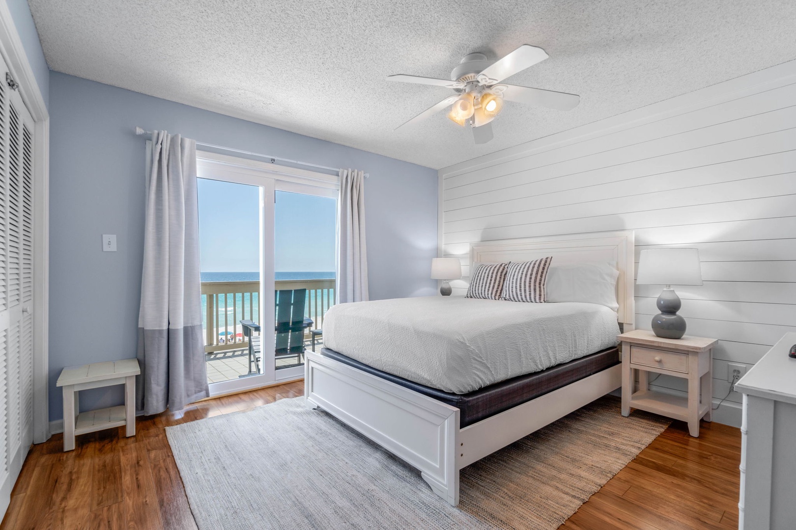 Master bedroom with queen bed & private balcony